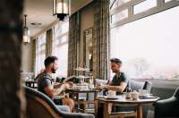 A couple enjoying afternoon tea at St. Brelade's Bay Hotel