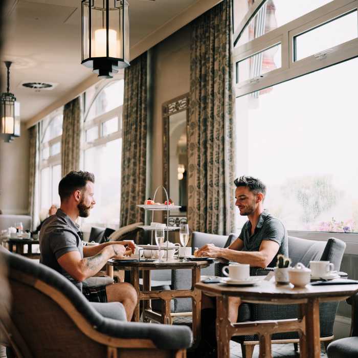 A couple enjoying afternoon tea at St. Brelade's Bay Hotel