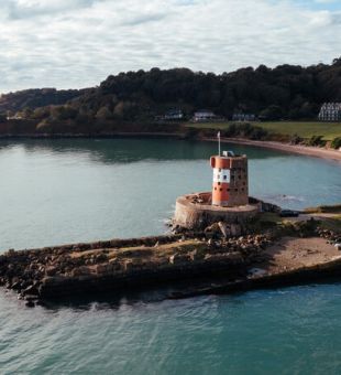 Archirondel tower with beach in background