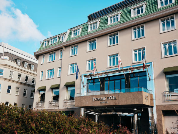 Traditional Hotel with flags flying outside