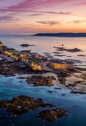 Aerial shot of a castle at dusk