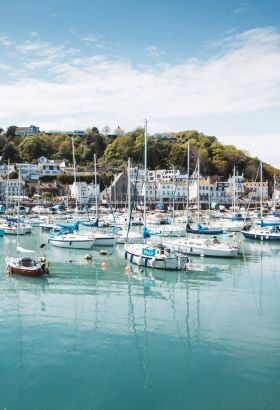 View overlooking a pretty fishing harbour with lots of boats