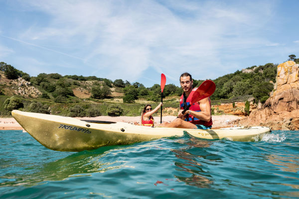 Person kayaking in the sea