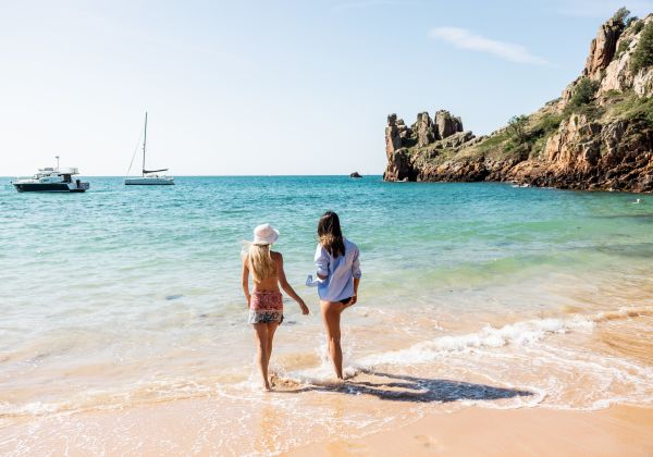 Two friends walking by the sea at Beauport, Jersey