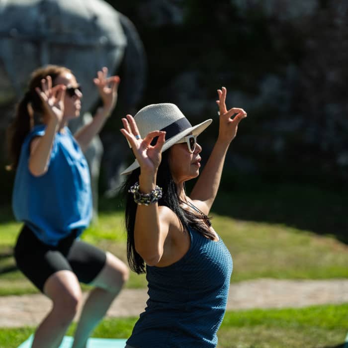 People doing yoga outside