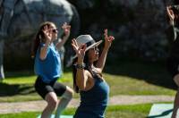 People doing yoga outside