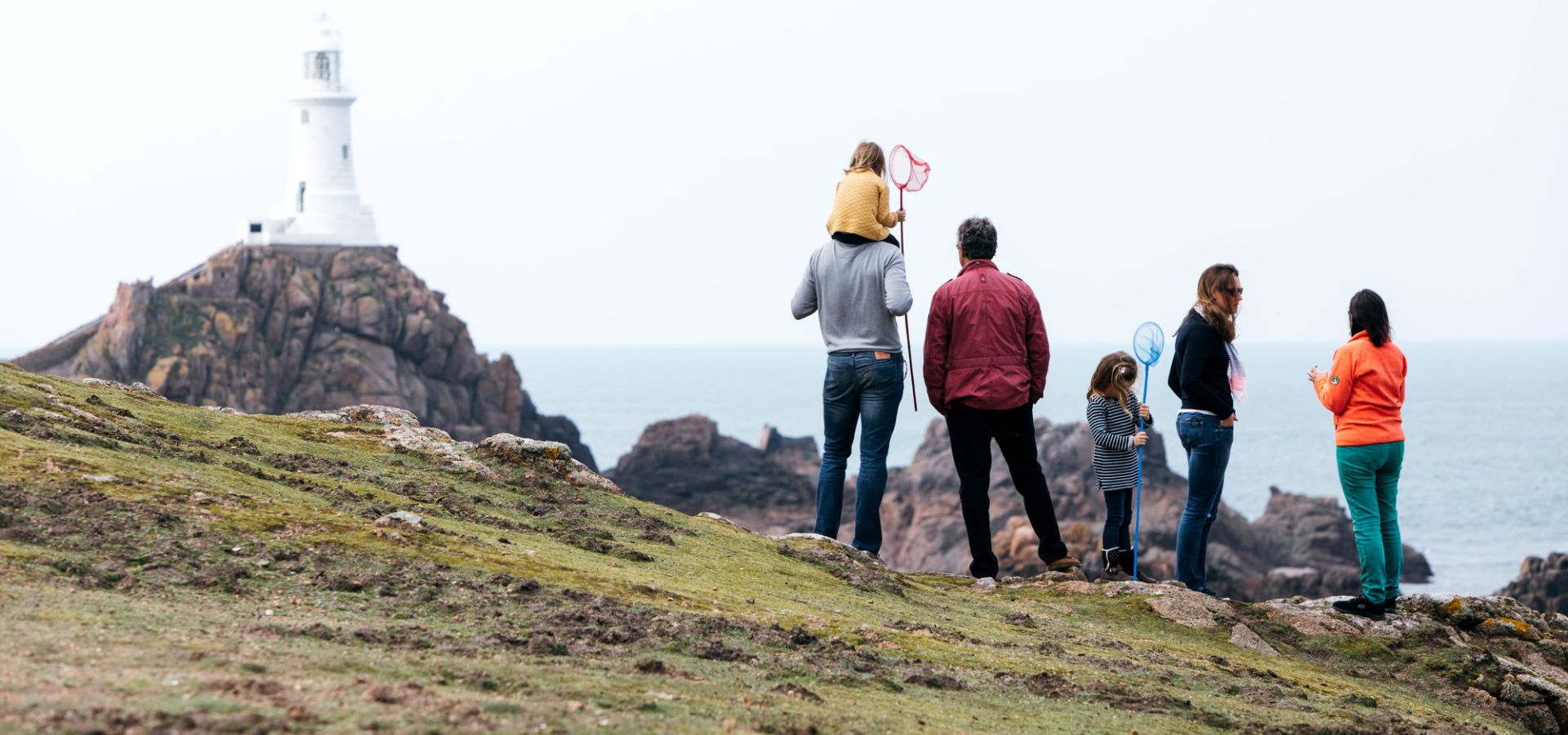 Family overlooking Corbiere Lighthouse