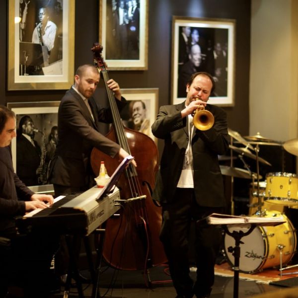 A trumpeteer playing inside a jazz bar in Jersey