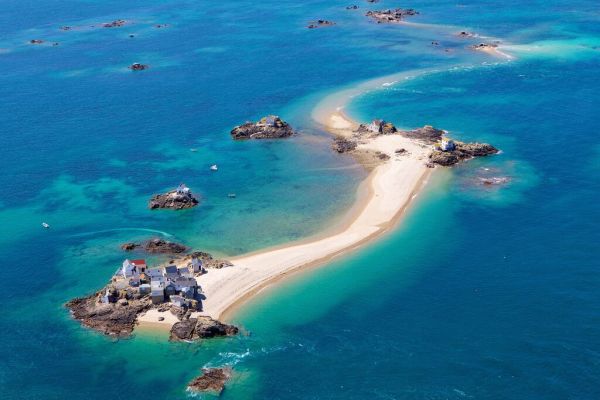 Aerial shot of Les Ecrehous, Jersey, surrounded by turquoise waters