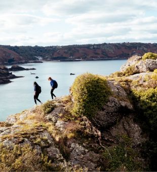Two walkers along the north coastal cliff path