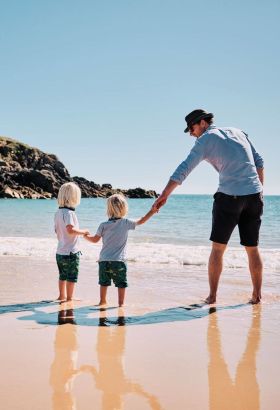 Family on beach at Portelet bay