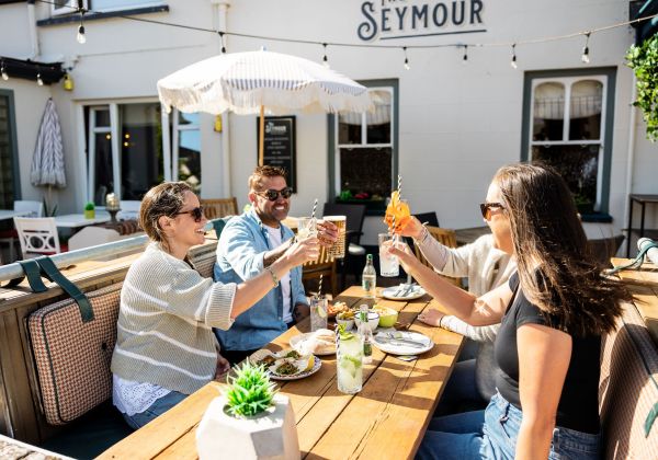 Group of friends having a meal at the Seymour Inn in Jersey