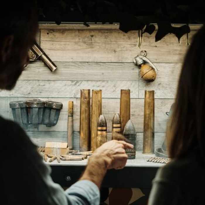 People looking at the displays in the Jersey War Tunnels.