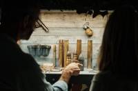 People looking at the displays in the Jersey War Tunnels.