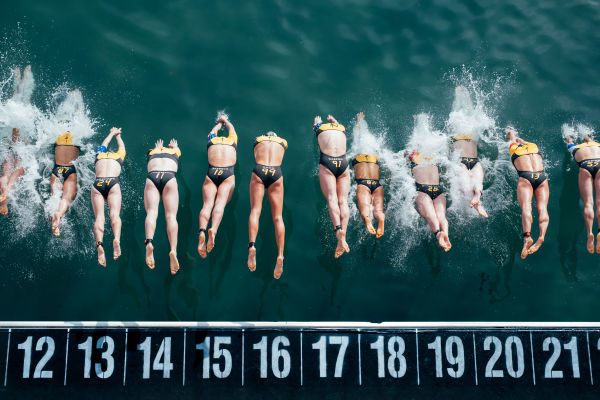 Super League Triathlon swimmers diving into the water