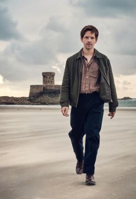 Bergerac actor Damien Molony walking along St. Ouen