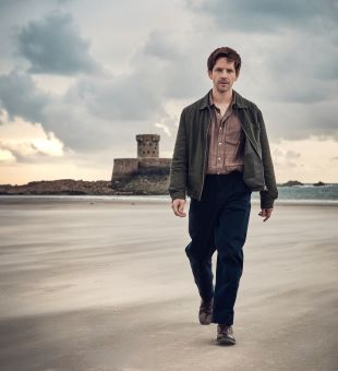 Bergerac actor Damien Molony walking along St. Ouen